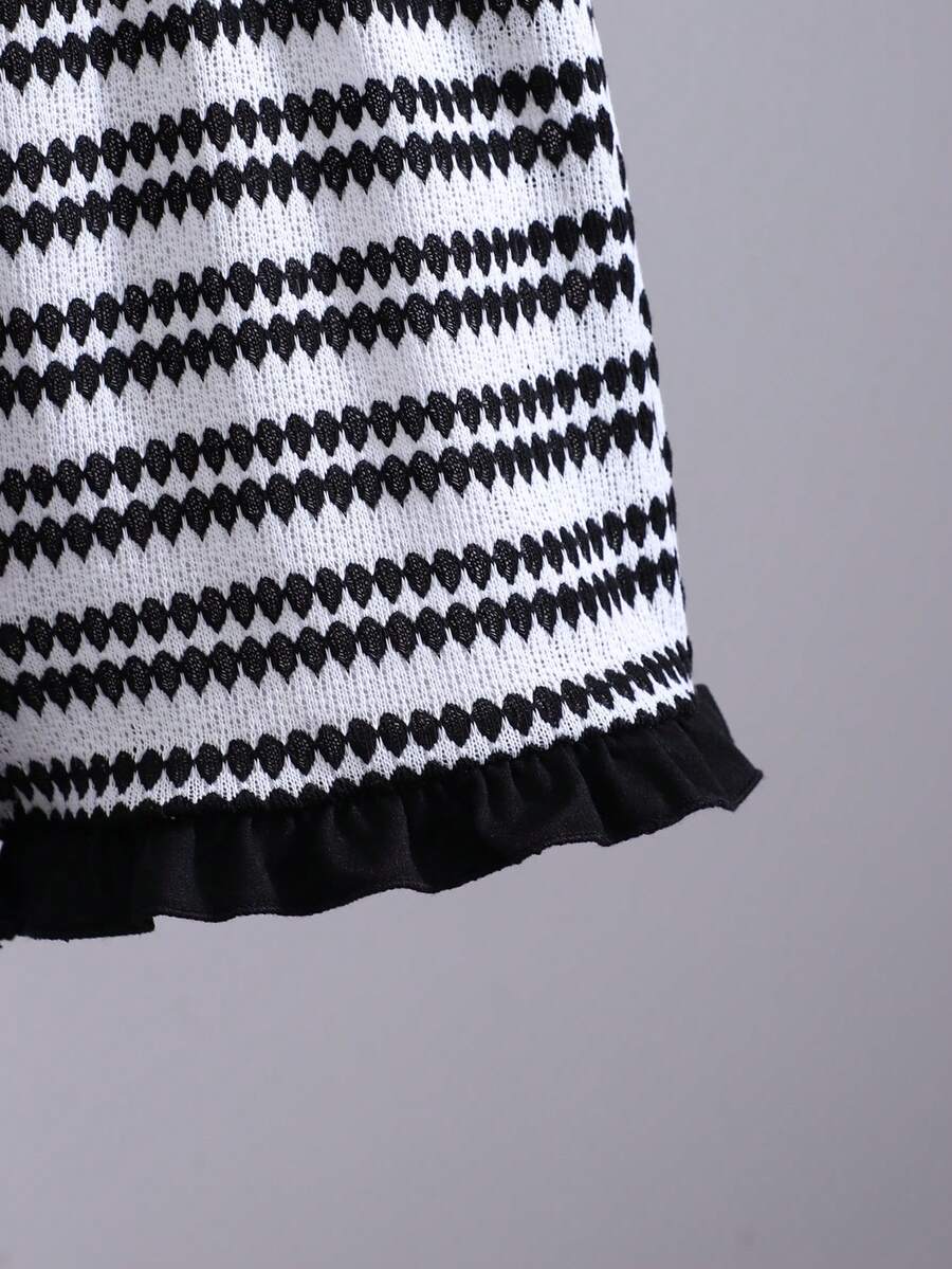 Tween girls black and white striped two-piece set featuring a spaghetti strap micro crop tank top with lettuce trim and ruffle hem paired with matching slim fit shorts.
