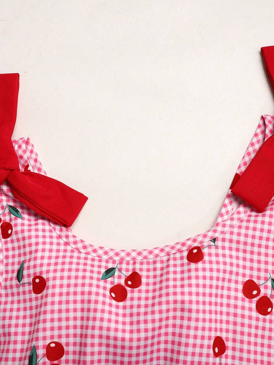 Black and white polka dot sleeveless A-line dress for tween girls featuring a scoop neck, high waist, and flared hem.