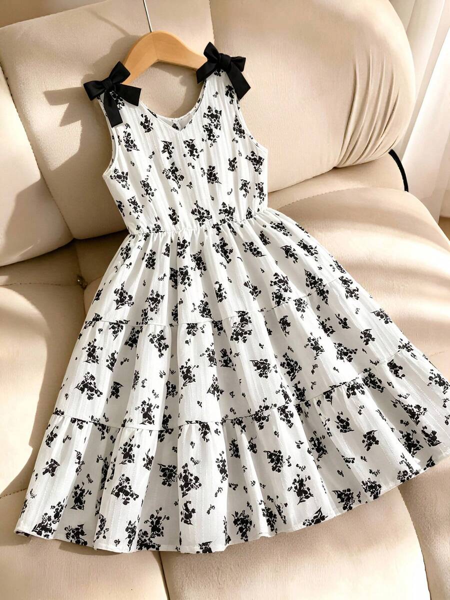 Girls sleeveless blue tiered dress featuring a V-neckline, high waist, and A-line skirt.