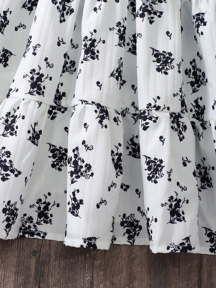 Girls sleeveless blue tiered dress featuring a V-neckline, high waist, and A-line skirt.