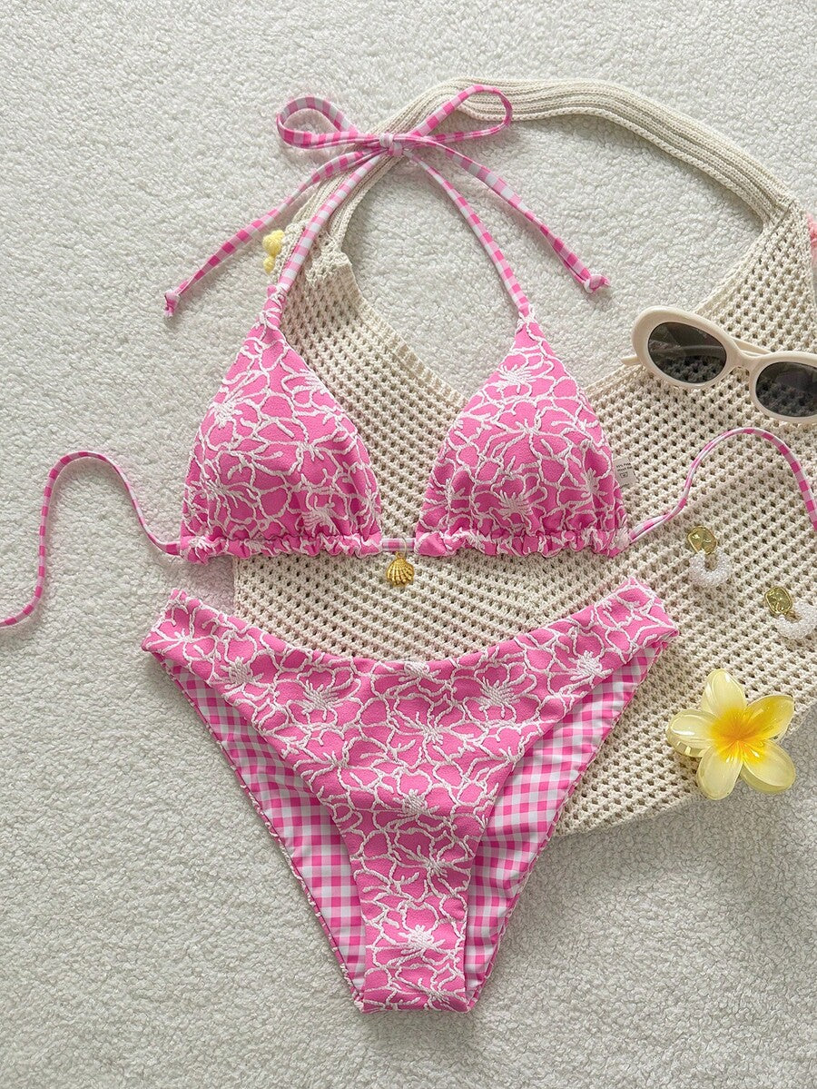 Women's black textured plaid 2-piece bikini set featuring a halter neckline, wireless triangle cups with removable padding, and mid-waist bottoms.