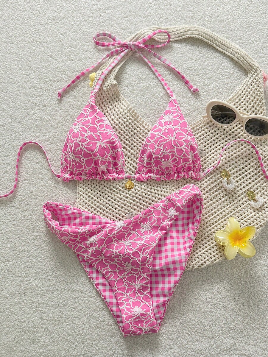 Women's black textured plaid 2-piece bikini set featuring a halter neckline, wireless triangle cups with removable padding, and mid-waist bottoms.