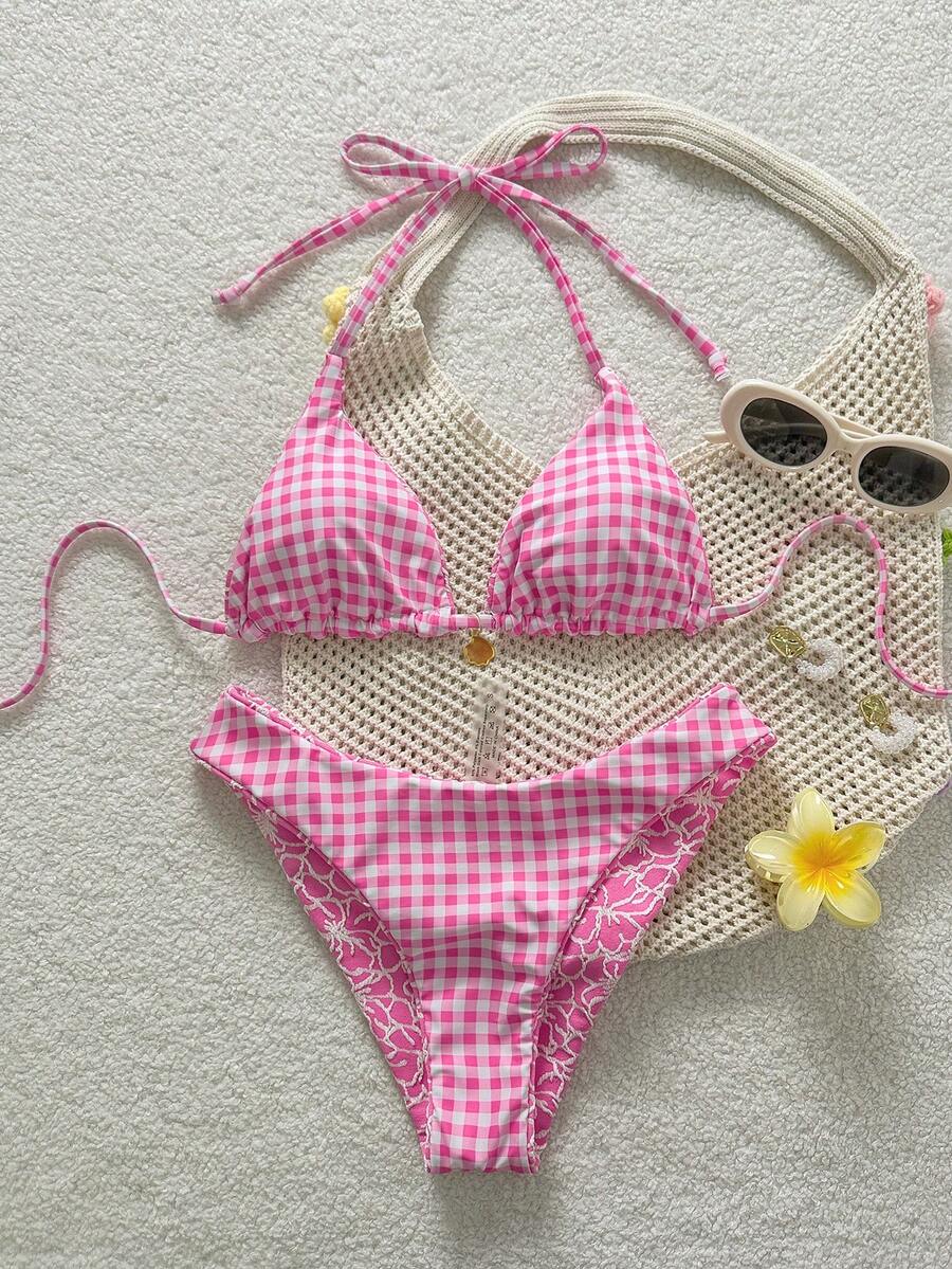 Women's black textured plaid 2-piece bikini set featuring a halter neckline, wireless triangle cups with removable padding, and mid-waist bottoms.