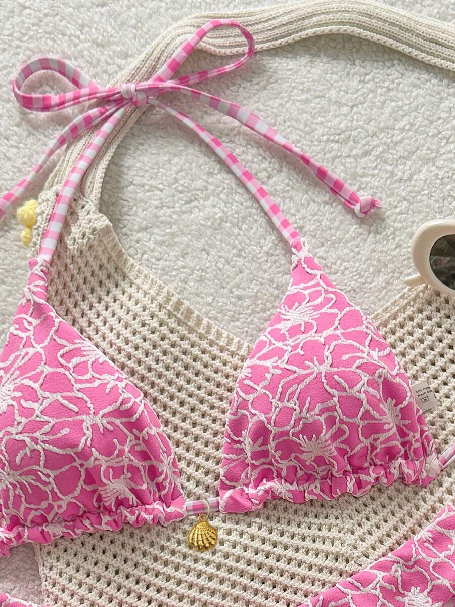 Women's black textured plaid 2-piece bikini set featuring a halter neckline, wireless triangle cups with removable padding, and mid-waist bottoms.