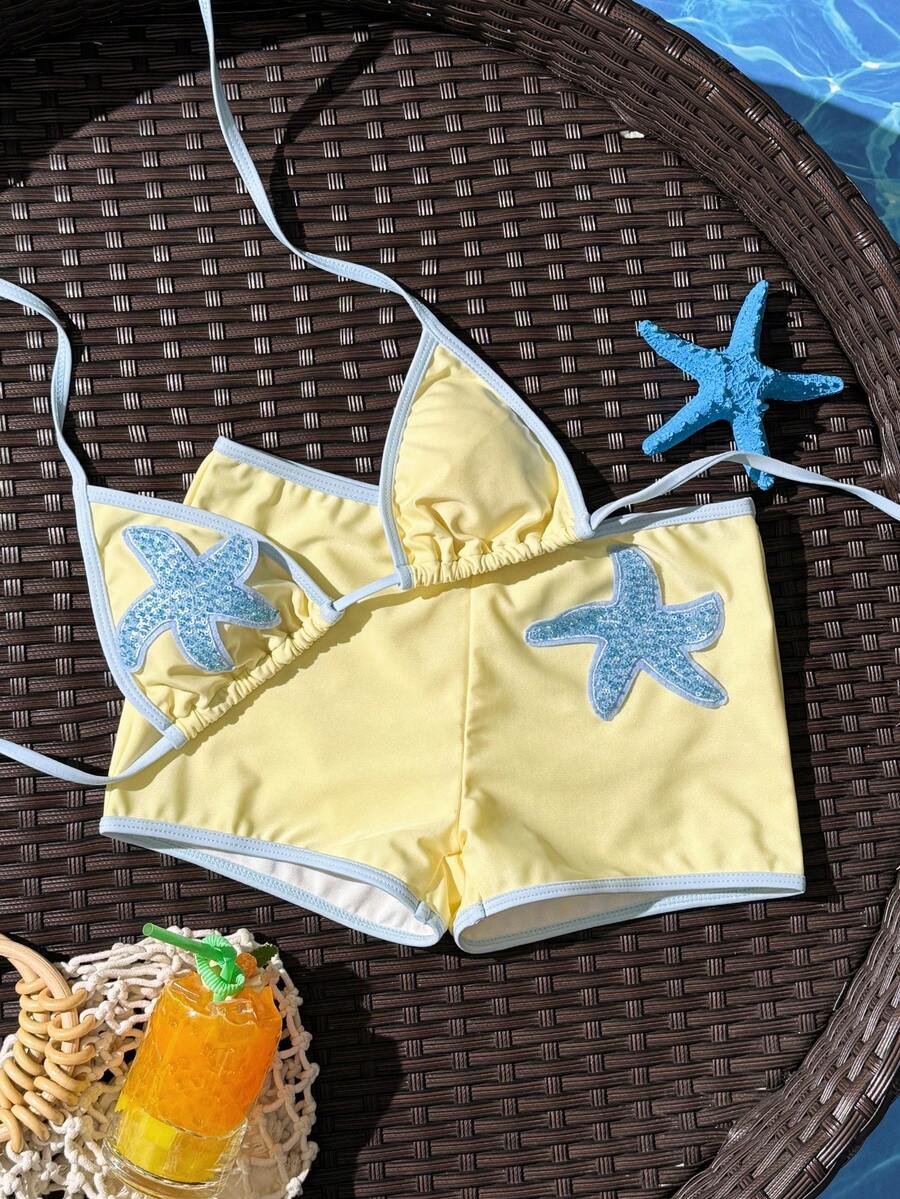 Women's apricot two-piece swimsuit set with a halter tie-back top and matching high stretch shorts.