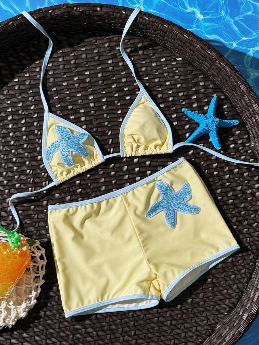 Women's apricot two-piece swimsuit set with a halter tie-back top and matching high stretch shorts.