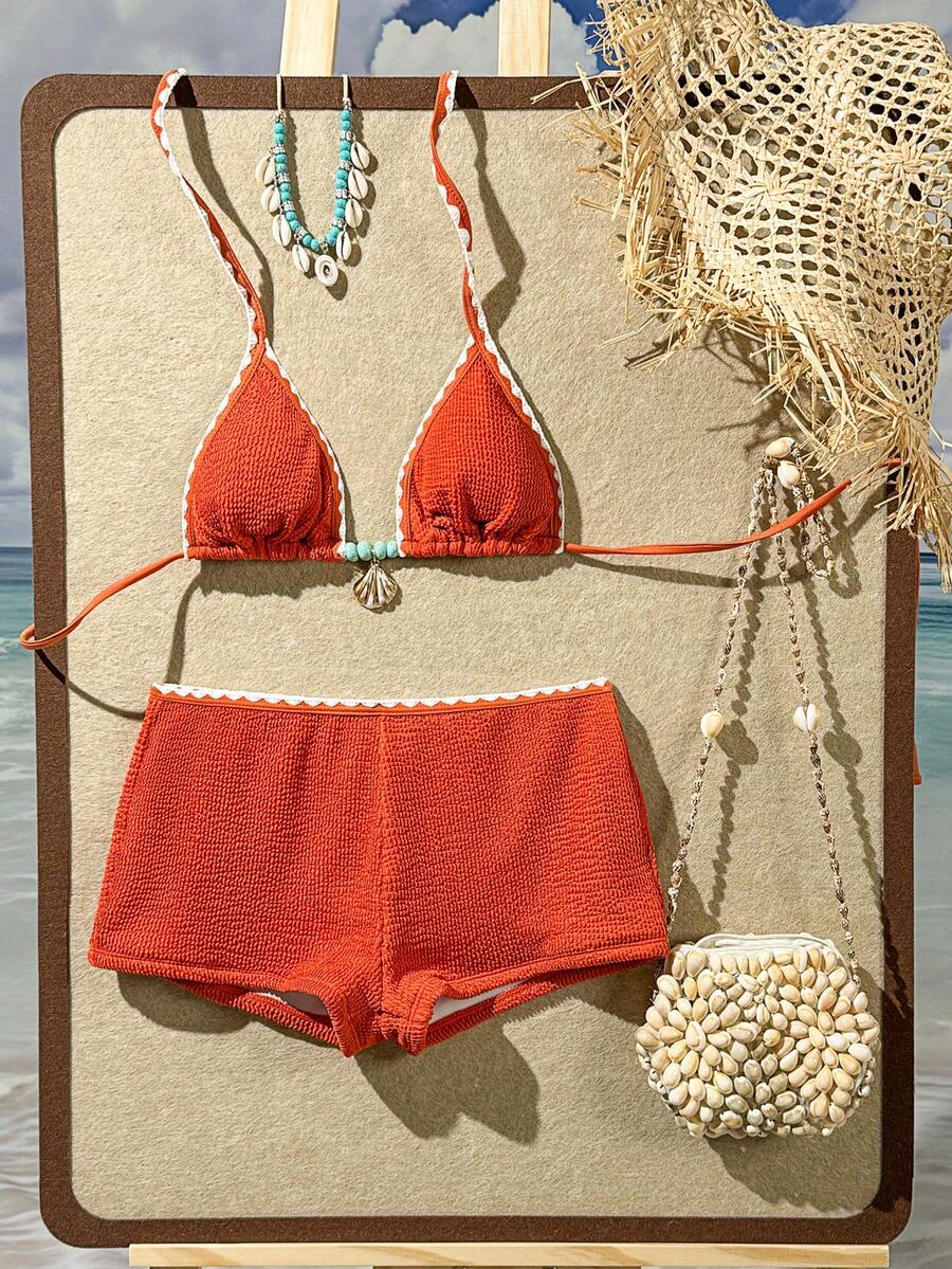 Women's apricot two-piece swimsuit set with a halter tie-back top and matching high stretch shorts.