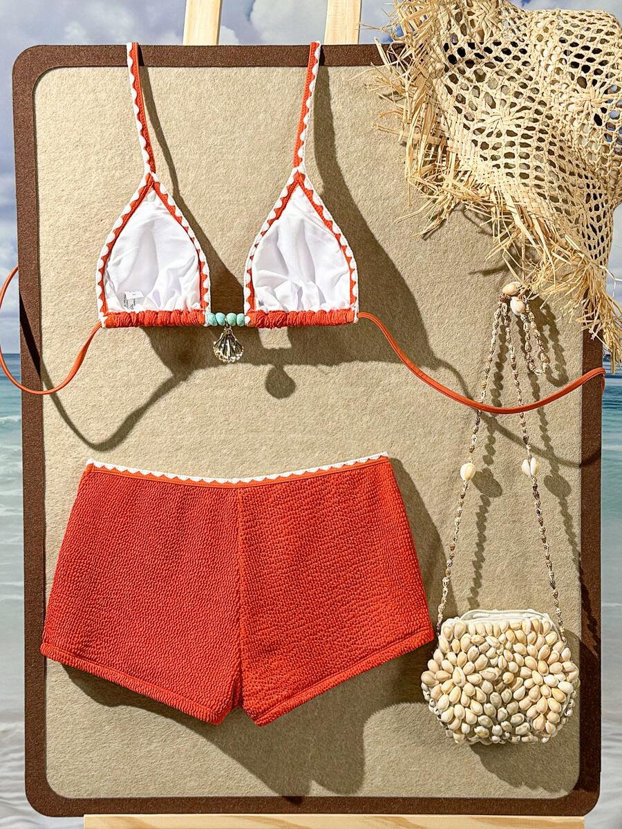 Women's apricot two-piece swimsuit set with a halter tie-back top and matching high stretch shorts.