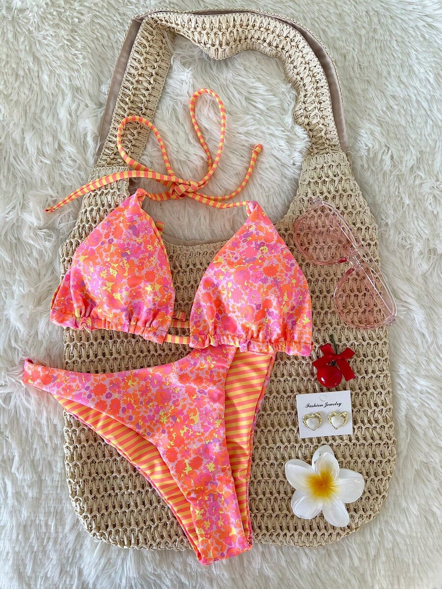 Women's two-piece halter bikini set featuring high cut thong bottoms and removable padding