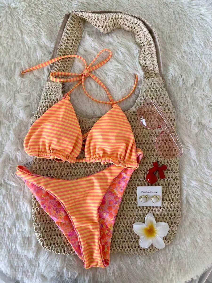 Women's two-piece halter bikini set featuring high cut thong bottoms and removable padding