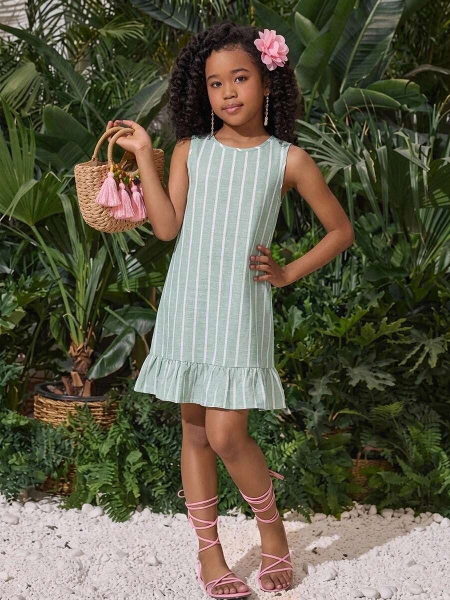 Tween girls blue denim effect sleeveless dress with round neck, button front details, and flounce hem.