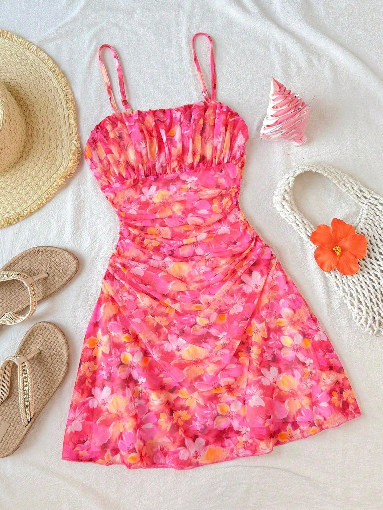 Tween girl yellow mini sundress with large pink floral hibiscus print, spaghetti straps, high waist, flared hem, and sleeveless cami style for summer beach wear