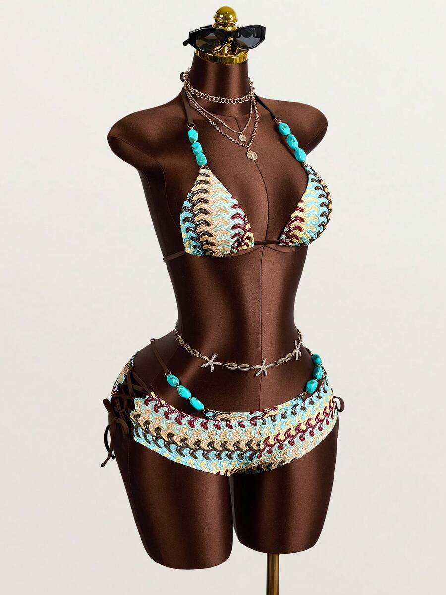 Multicolor 3-piece swimsuit set for women featuring an all-over print halter bralette top with backless knot details and high waist matching bottoms.