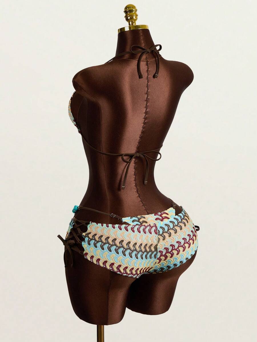 Multicolor 3-piece swimsuit set for women featuring an all-over print halter bralette top with backless knot details and high waist matching bottoms.