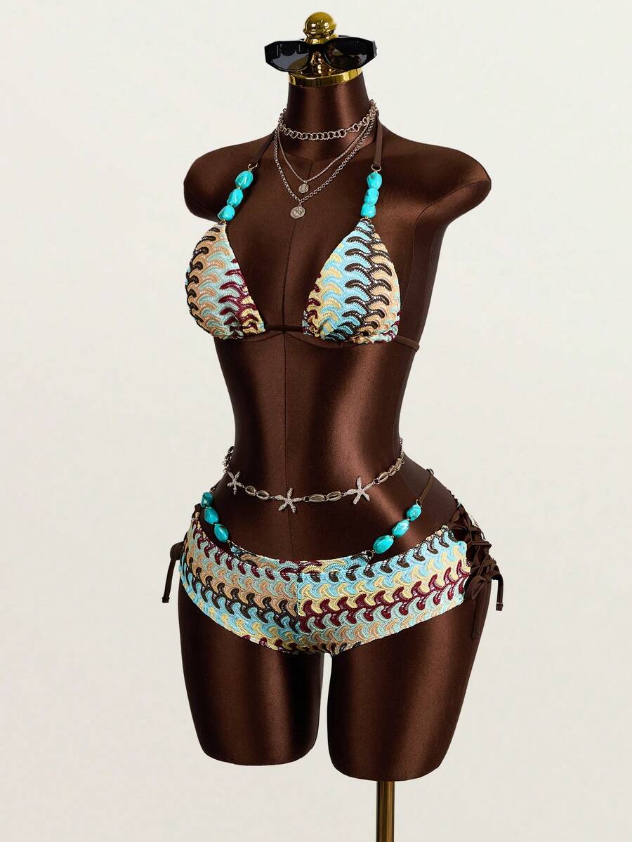 Multicolor 3-piece swimsuit set for women featuring an all-over print halter bralette top with backless knot details and high waist matching bottoms.