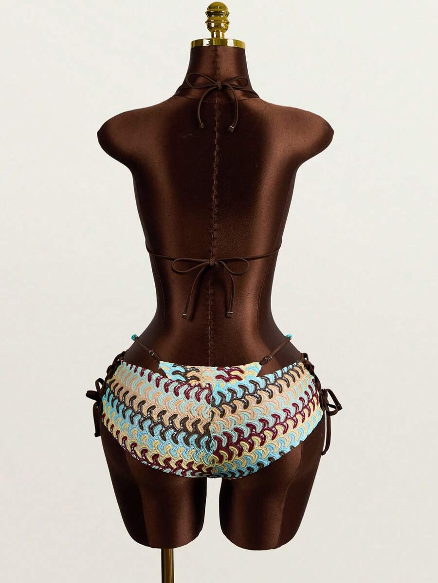 Multicolor 3-piece swimsuit set for women featuring an all-over print halter bralette top with backless knot details and high waist matching bottoms.