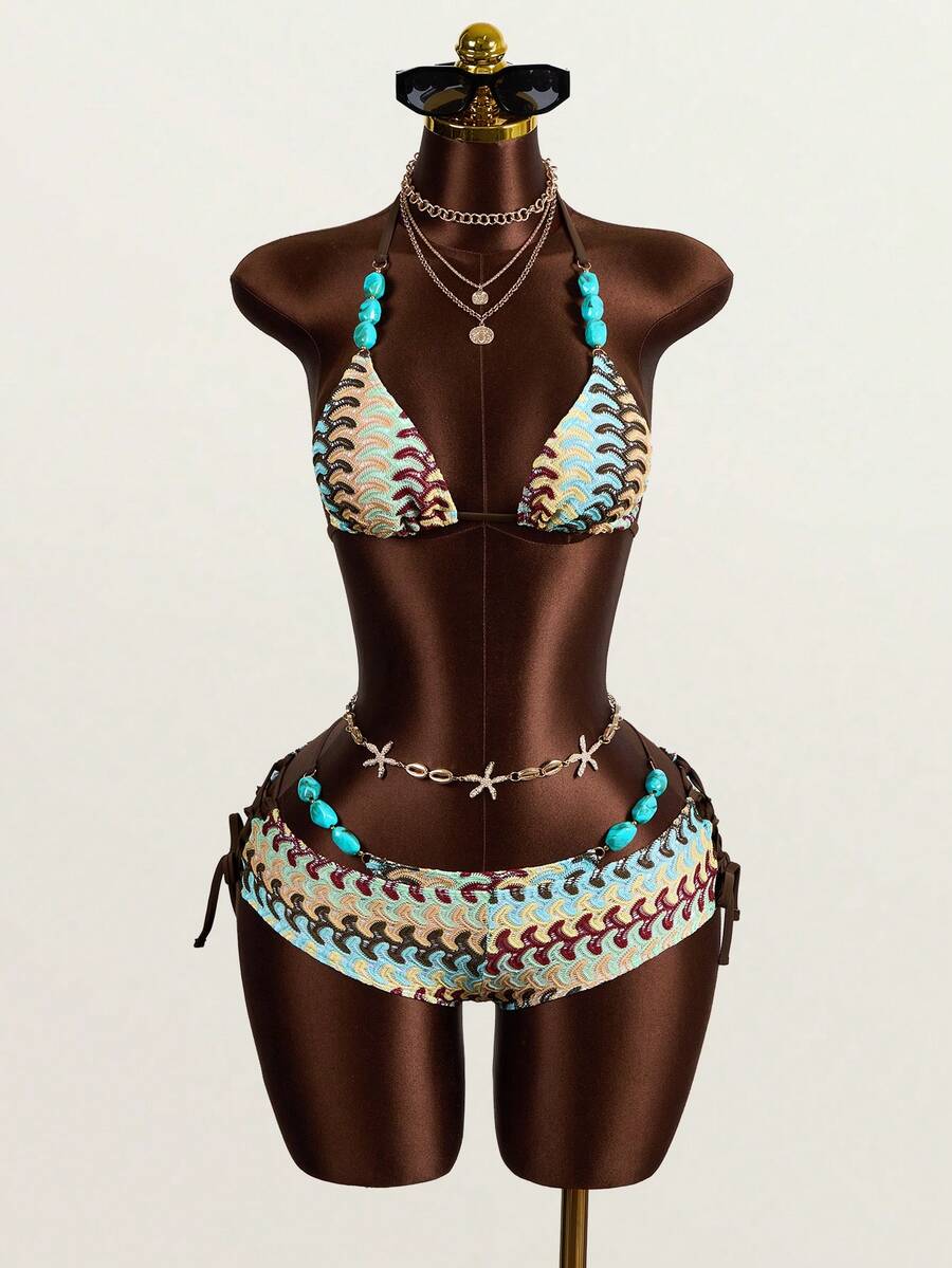 Multicolor 3-piece swimsuit set for women featuring an all-over print halter bralette top with backless knot details and high waist matching bottoms.
