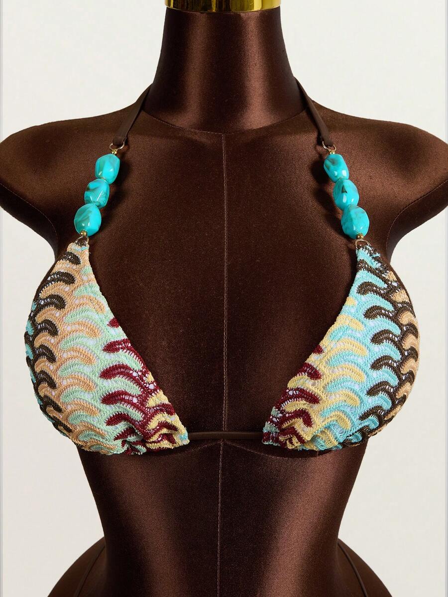 Multicolor 3-piece swimsuit set for women featuring an all-over print halter bralette top with backless knot details and high waist matching bottoms.