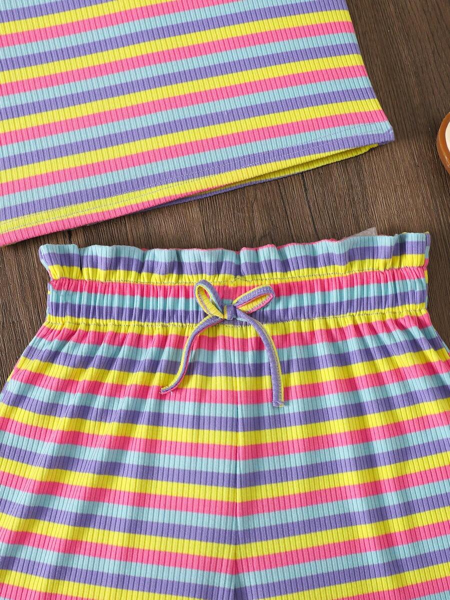 Black and white striped 2-piece set for tween girls featuring a halter sleeveless pullover top with criss-cross knot detail and matching paperbag waist shorts.