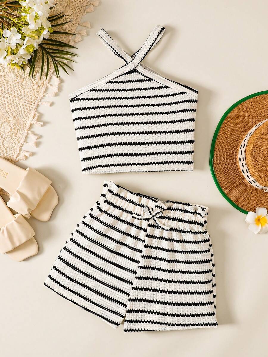 Black and white striped 2-piece set for tween girls featuring a halter sleeveless pullover top with criss-cross knot detail and matching paperbag waist shorts.
