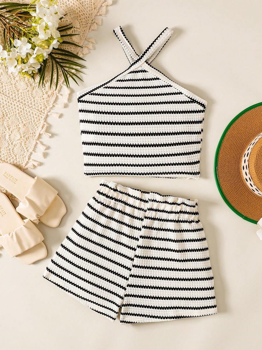 Black and white striped 2-piece set for tween girls featuring a halter sleeveless pullover top with criss-cross knot detail and matching paperbag waist shorts.