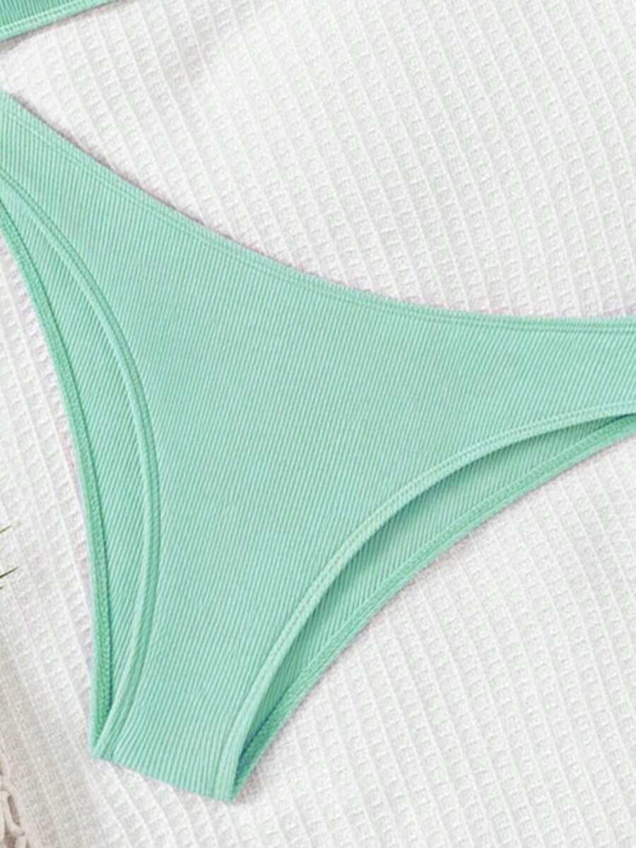 Apricot ribbed high waist two piece bikini swimsuit set for women featuring backless spaghetti strap top and high waisted bottoms.