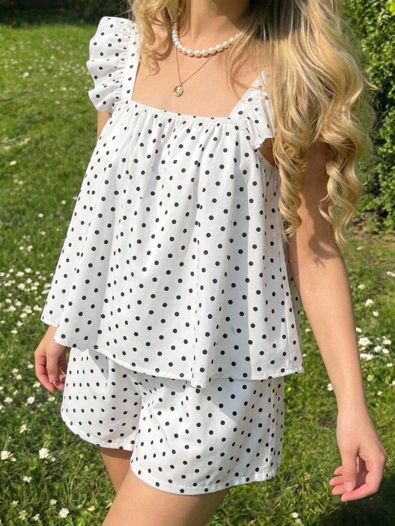 Tween girls 2-piece bohemian outfit set in apricot featuring a square neck embroidered sleeveless camisole top and matching floral wide leg shorts.