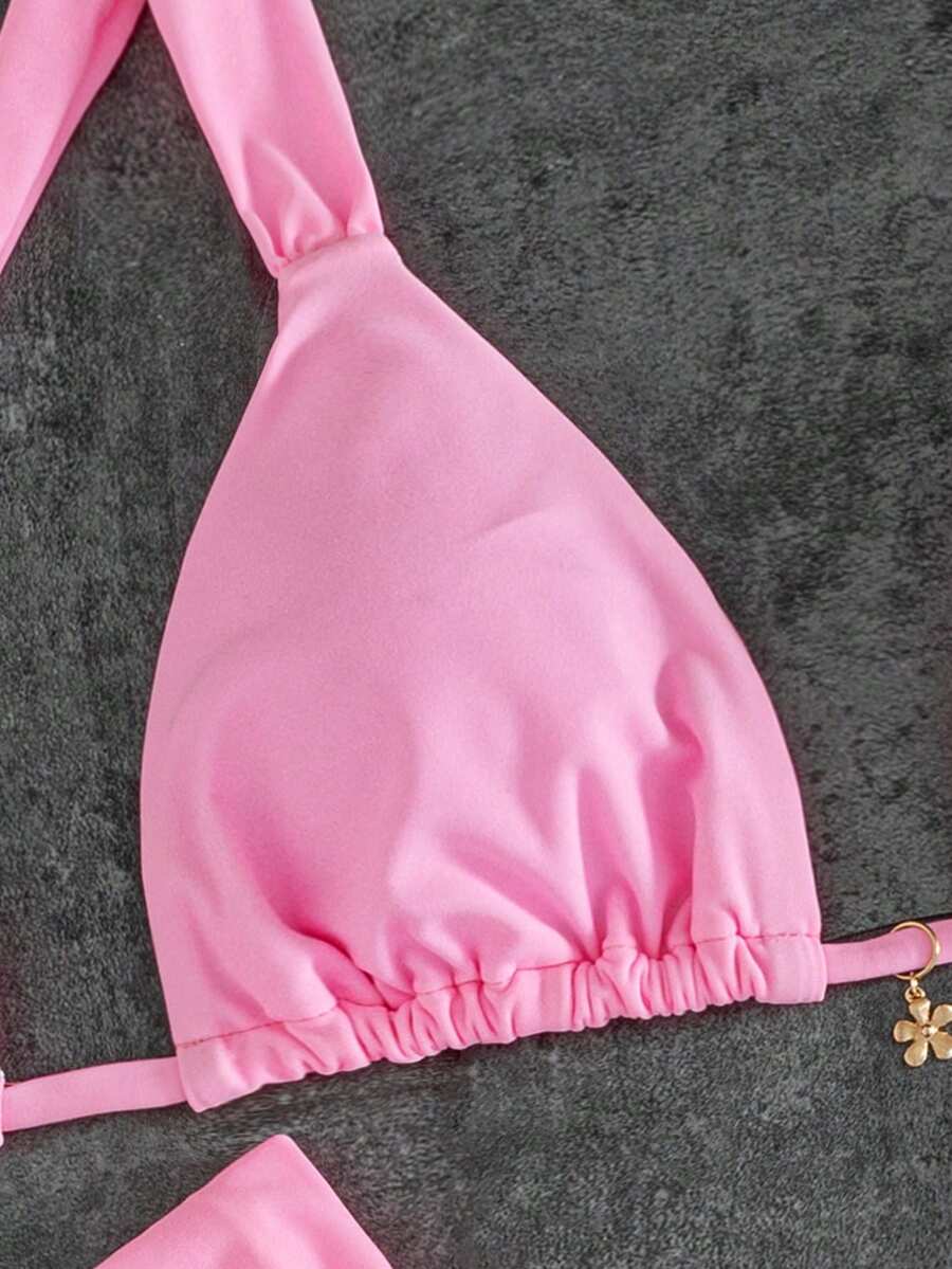 Women's solid yellow 2-piece bikini set featuring a high-waist bottom and a wireless bandeau top on display for beach and resort wear.