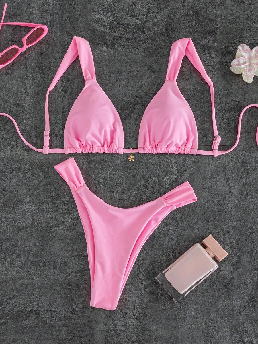 Women's solid yellow 2-piece bikini set featuring a high-waist bottom and a wireless bandeau top on display for beach and resort wear.