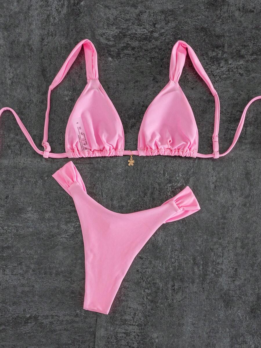 Women's solid yellow 2-piece bikini set featuring a high-waist bottom and a wireless bandeau top on display for beach and resort wear.