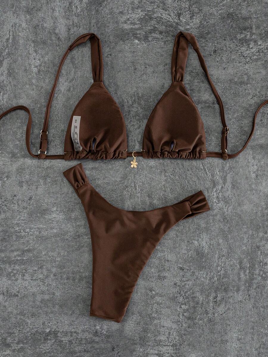 Women's solid yellow 2-piece bikini set featuring a high-waist bottom and a wireless bandeau top on display for beach and resort wear.