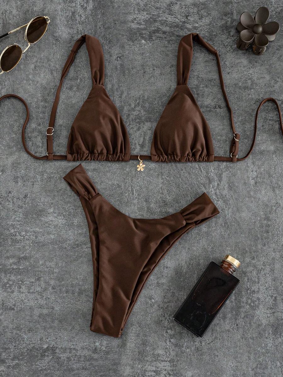 Women's solid yellow 2-piece bikini set featuring a high-waist bottom and a wireless bandeau top on display for beach and resort wear.