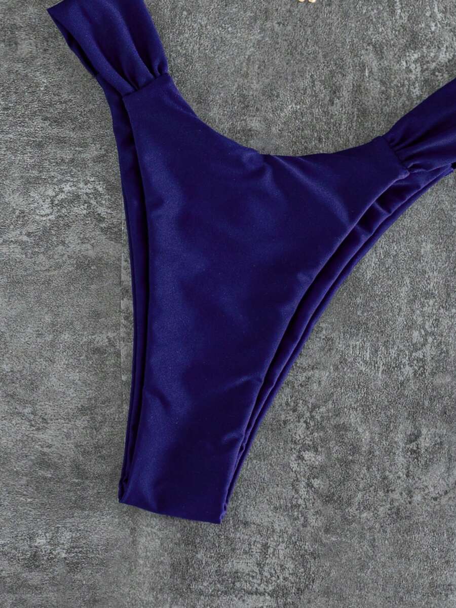 Women's solid yellow 2-piece bikini set featuring a high-waist bottom and a wireless bandeau top on display for beach and resort wear.