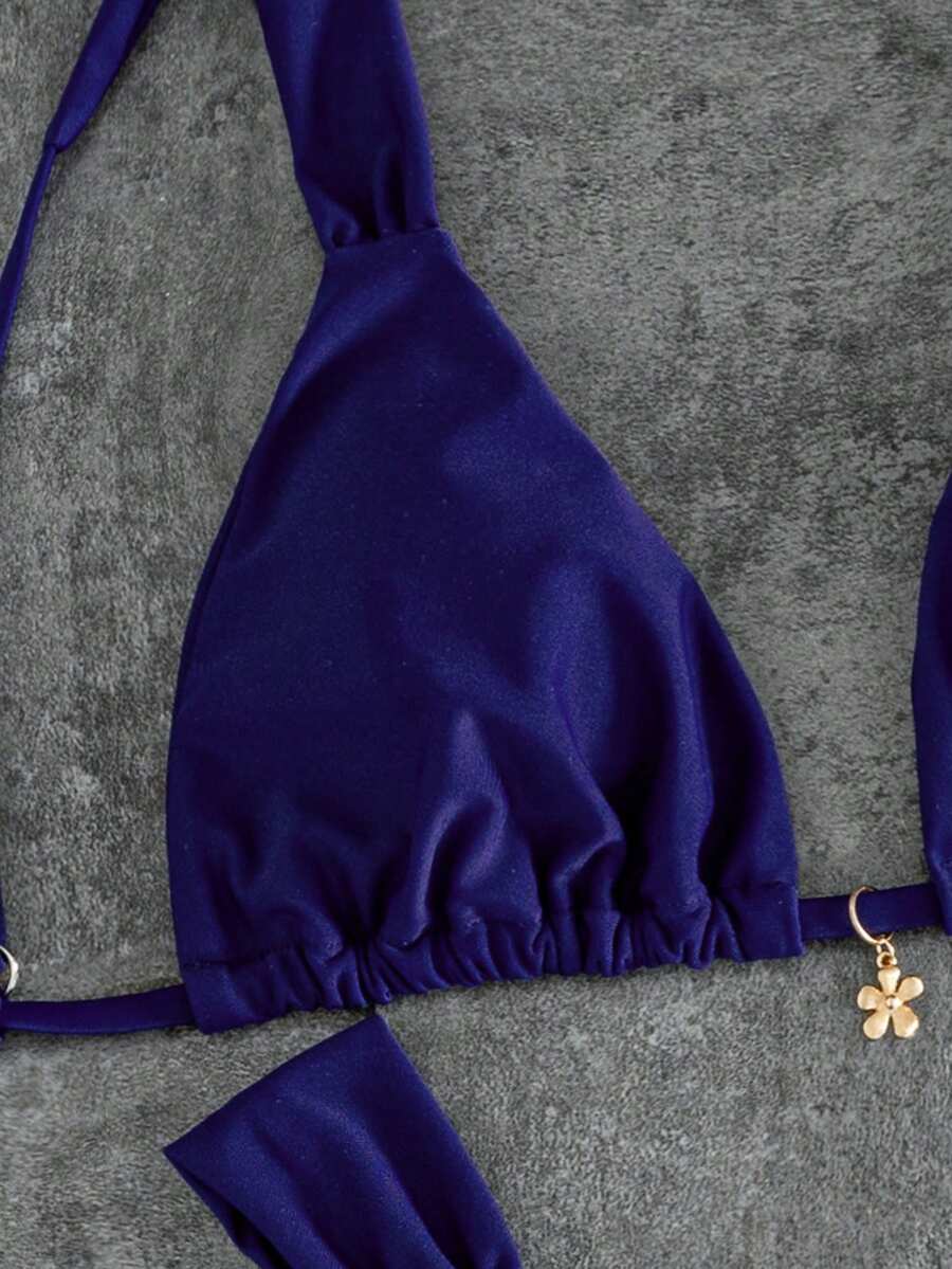 Women's solid yellow 2-piece bikini set featuring a high-waist bottom and a wireless bandeau top on display for beach and resort wear.