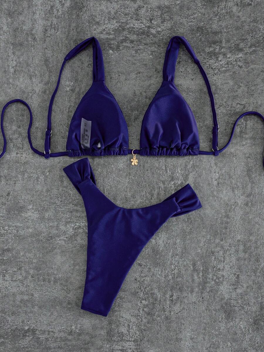 Women's solid yellow 2-piece bikini set featuring a high-waist bottom and a wireless bandeau top on display for beach and resort wear.