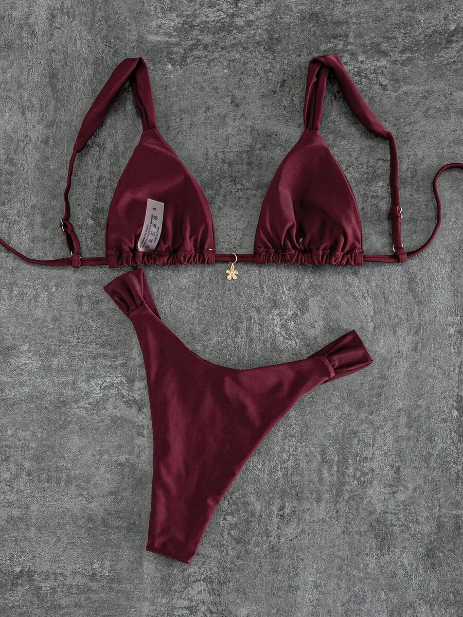 Women's solid yellow 2-piece bikini set featuring a high-waist bottom and a wireless bandeau top on display for beach and resort wear.