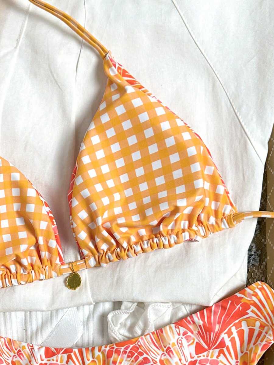 Women's black textured plaid 2-piece bikini set featuring a halter neckline, wireless triangle cups with removable padding, and mid-waist bottoms.
