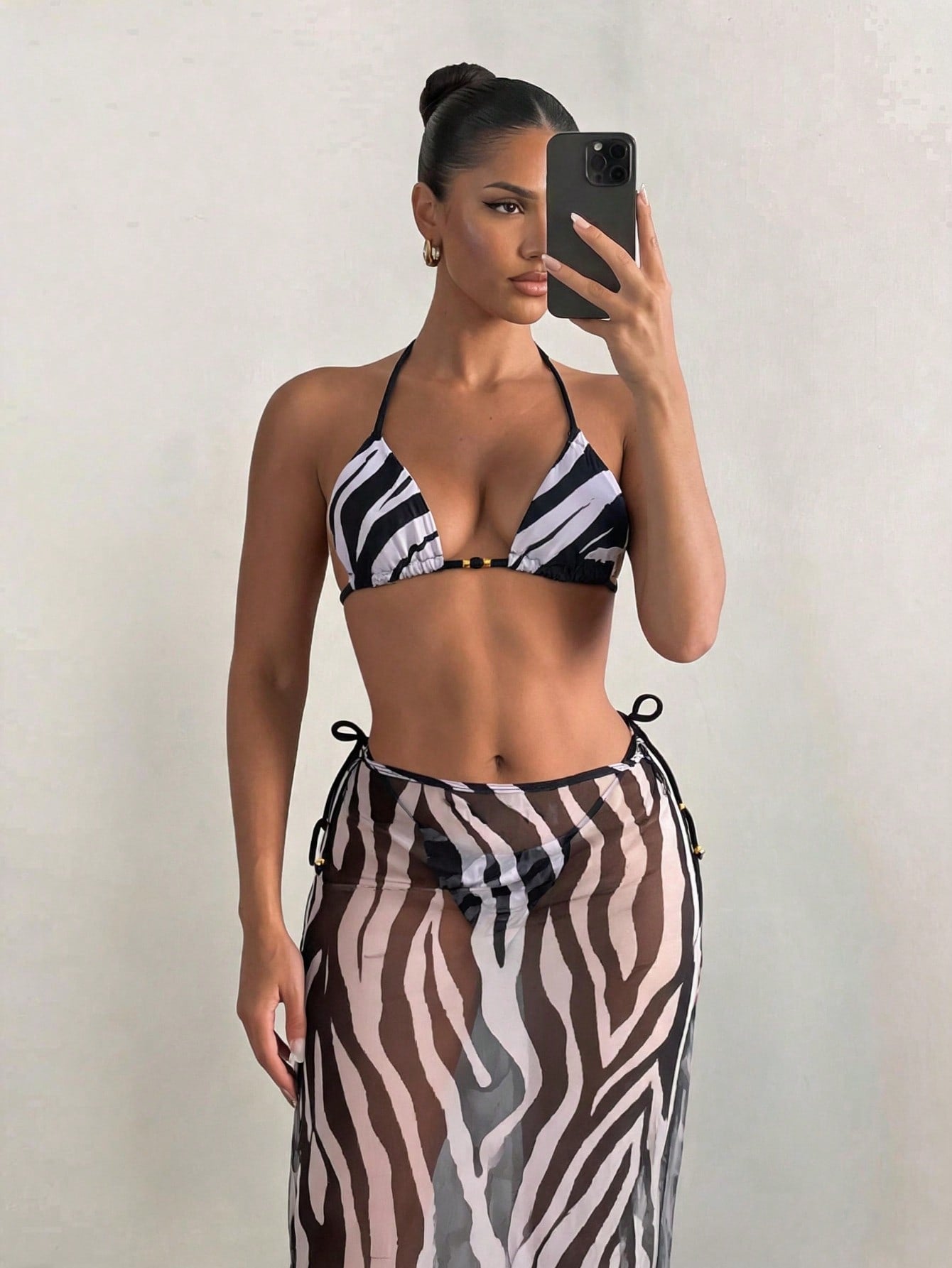Women's 3-piece zebra print swimwear set featuring a wireless halter top, tie-side bottoms, and a long sheer mesh skirt cover-up.