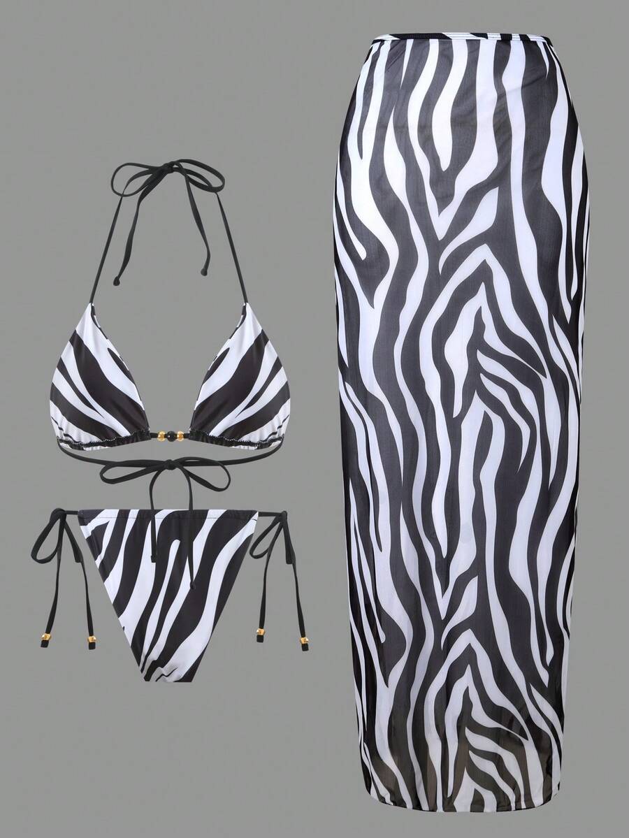 Women's 3-piece zebra print swimwear set featuring a wireless halter top, tie-side bottoms, and a long sheer mesh skirt cover-up.