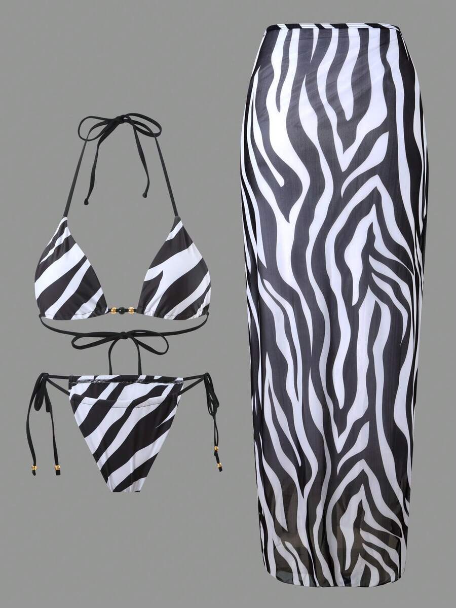 Women's 3-piece zebra print swimwear set featuring a wireless halter top, tie-side bottoms, and a long sheer mesh skirt cover-up.