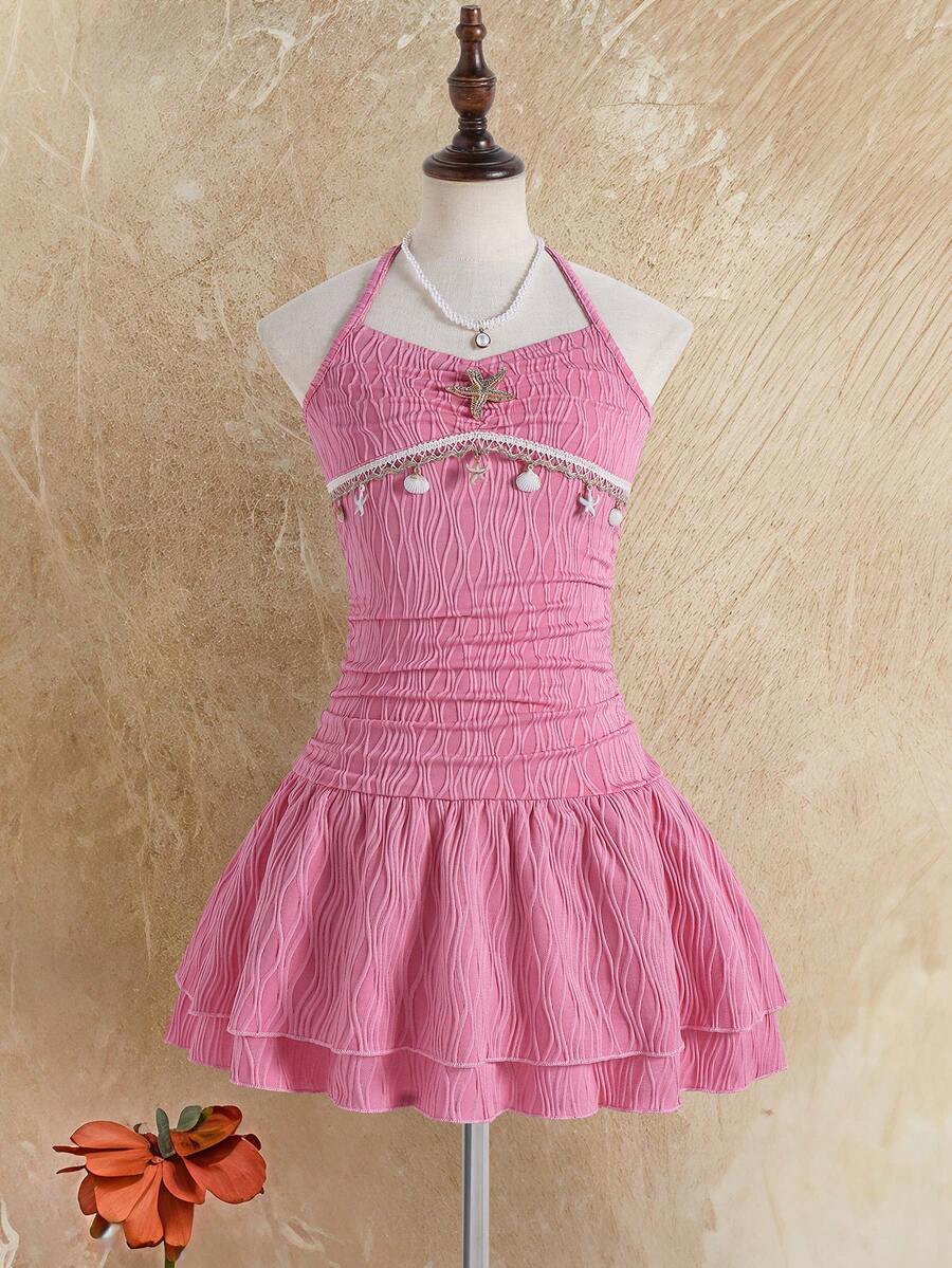 Tween girls apricot sleeveless halter mini dress with textured starfish and shell decor, shirred tiered layer, high waist, and flounce hem.