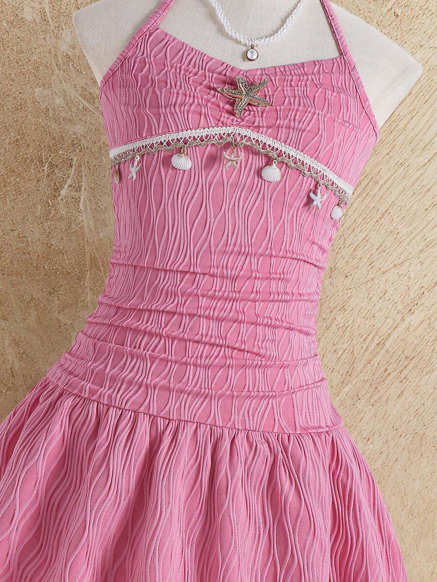 Tween girls apricot sleeveless halter mini dress with textured starfish and shell decor, shirred tiered layer, high waist, and flounce hem.