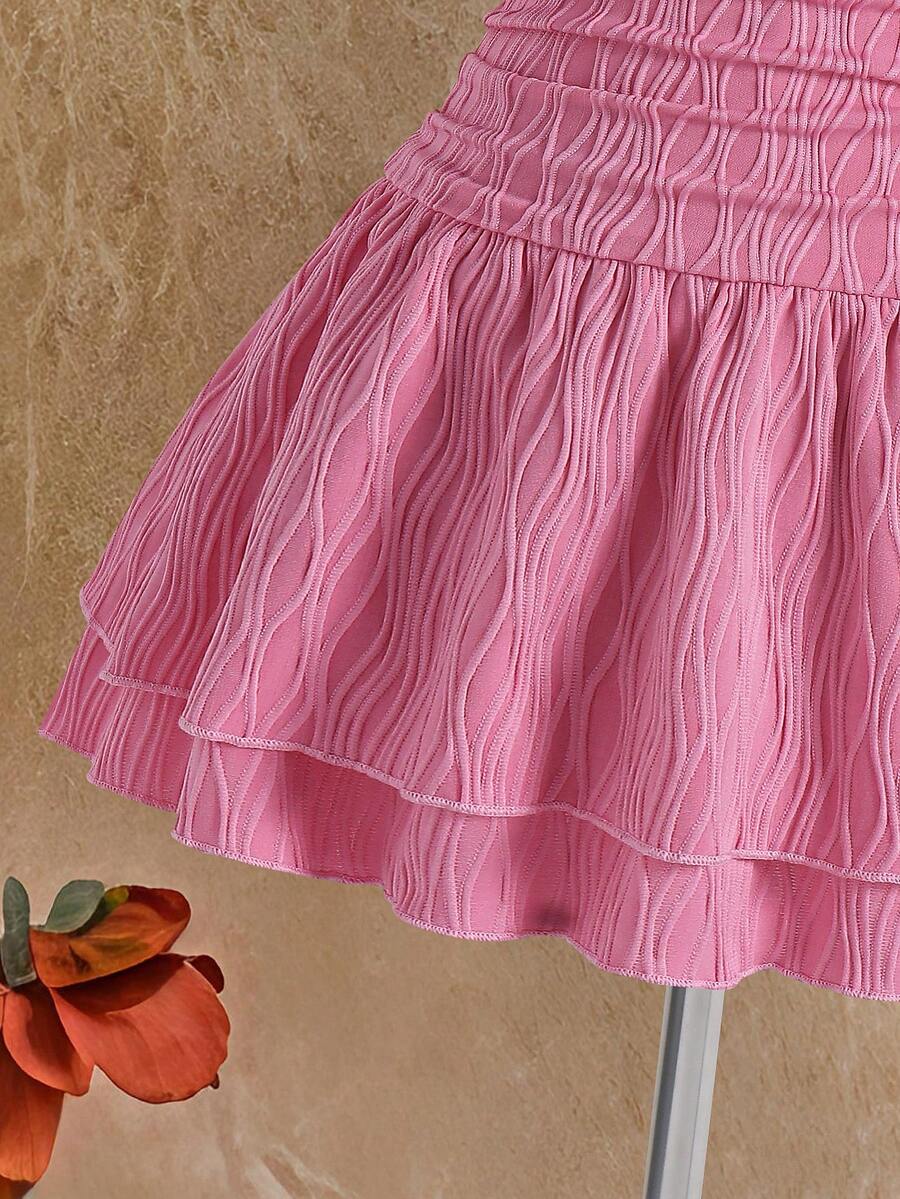 Tween girls apricot sleeveless halter mini dress with textured starfish and shell decor, shirred tiered layer, high waist, and flounce hem.