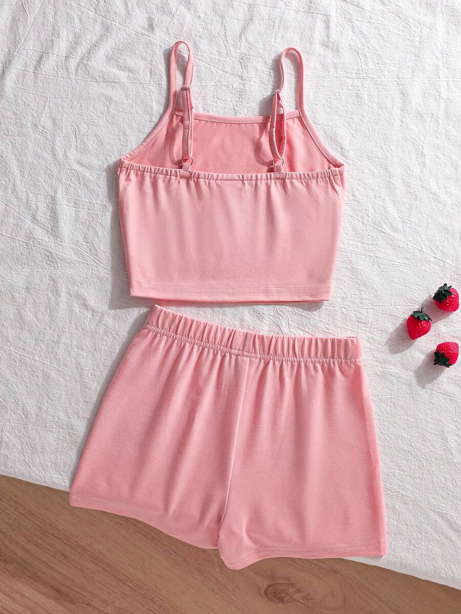 Tween girls summer 2-piece Hawaiian style outfit featuring a graphic print spaghetti strap camisole top with contrast piping and matching casual shorts.