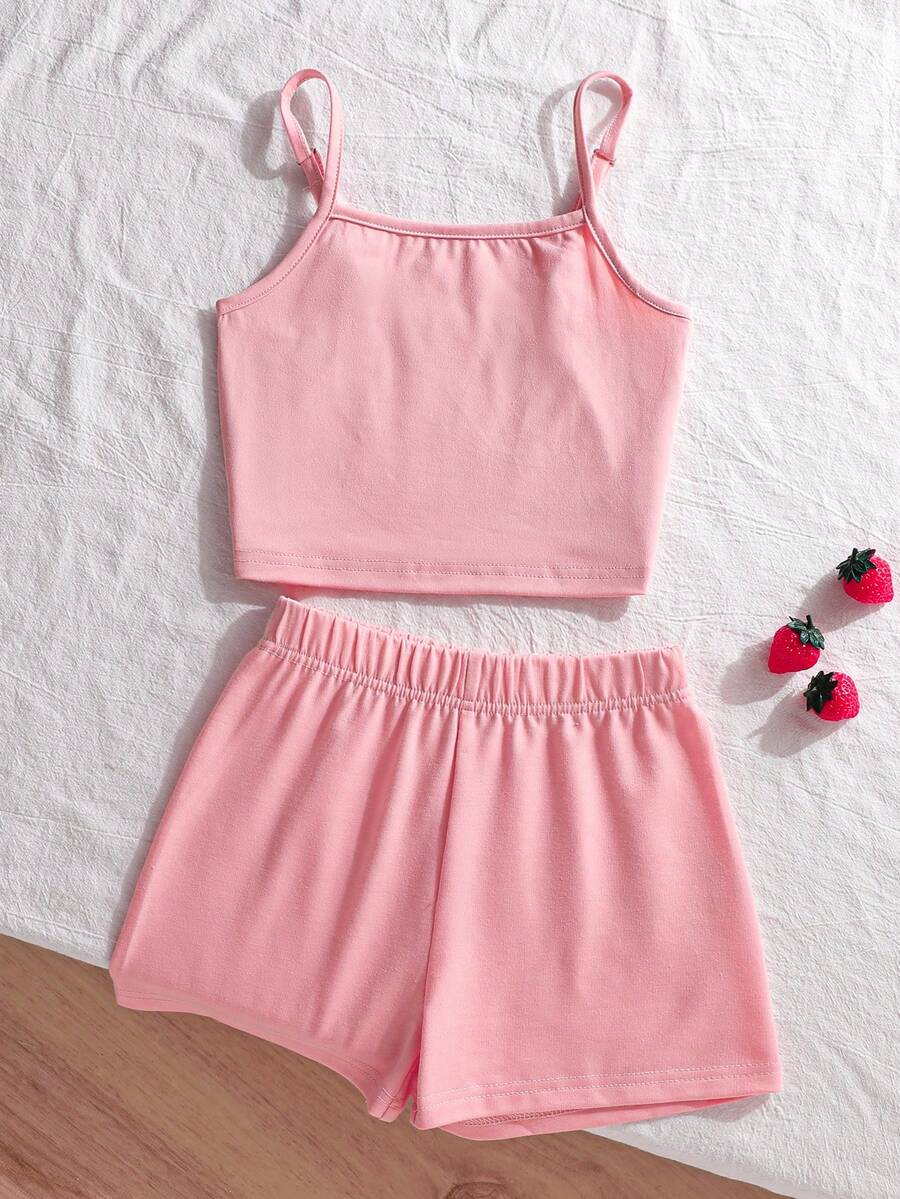 Tween girls summer 2-piece Hawaiian style outfit featuring a graphic print spaghetti strap camisole top with contrast piping and matching casual shorts.