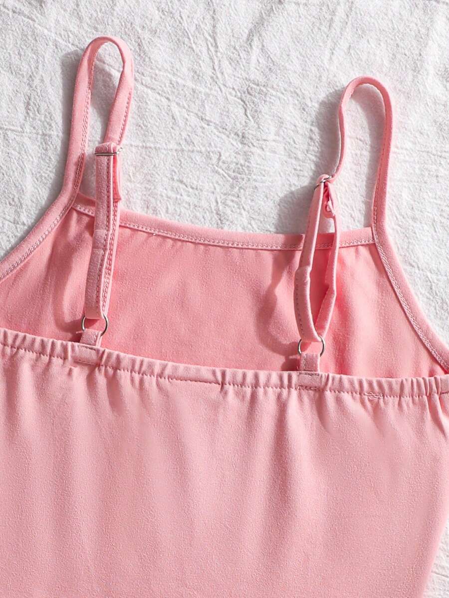 Tween girls summer 2-piece Hawaiian style outfit featuring a graphic print spaghetti strap camisole top with contrast piping and matching casual shorts.