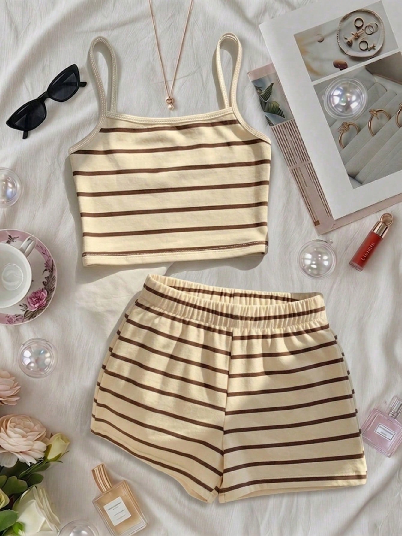 Tween girls summer 2-piece Hawaiian style outfit featuring a graphic print spaghetti strap camisole top with contrast piping and matching casual shorts.
