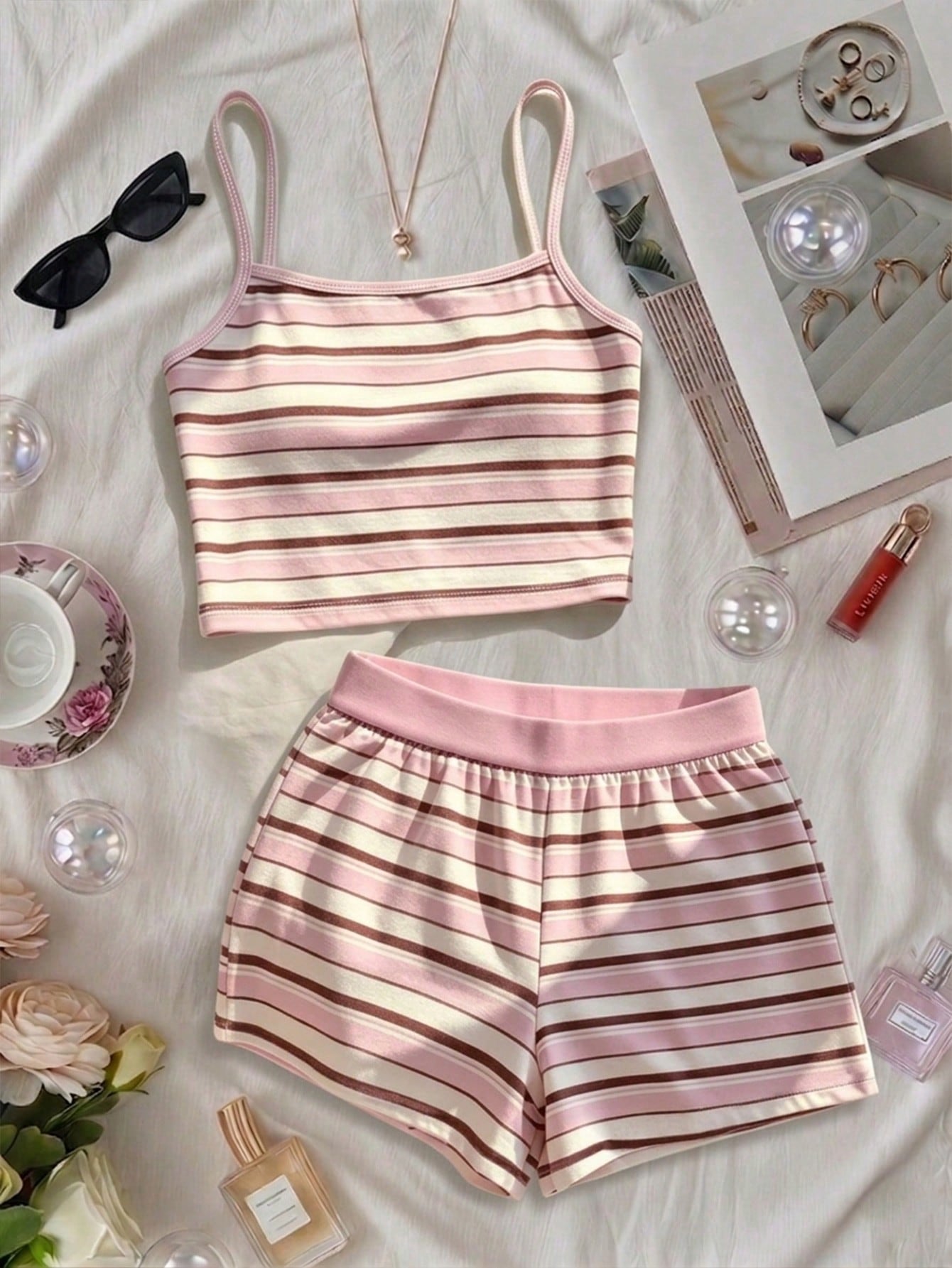Tween girls summer 2-piece Hawaiian style outfit featuring a graphic print spaghetti strap camisole top with contrast piping and matching casual shorts.
