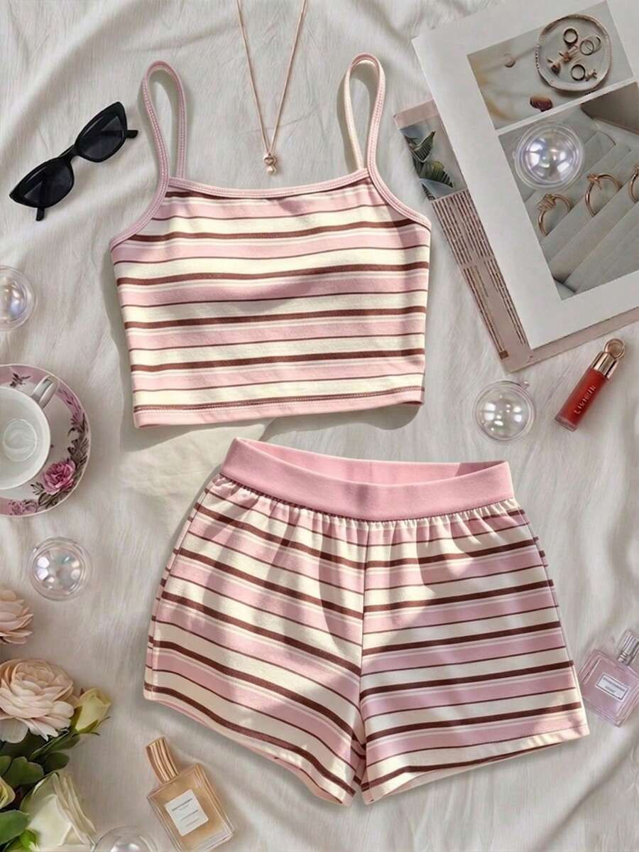 Tween girls summer 2-piece Hawaiian style outfit featuring a graphic print spaghetti strap camisole top with contrast piping and matching casual shorts.