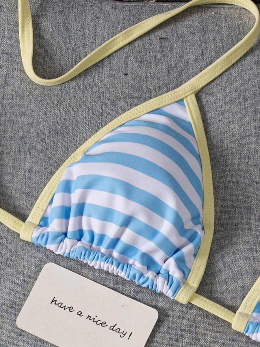 Women's two-piece halter triangle bikini set featuring a backless tie-back top with removable padding and matching tie-side mid-waist bottoms.